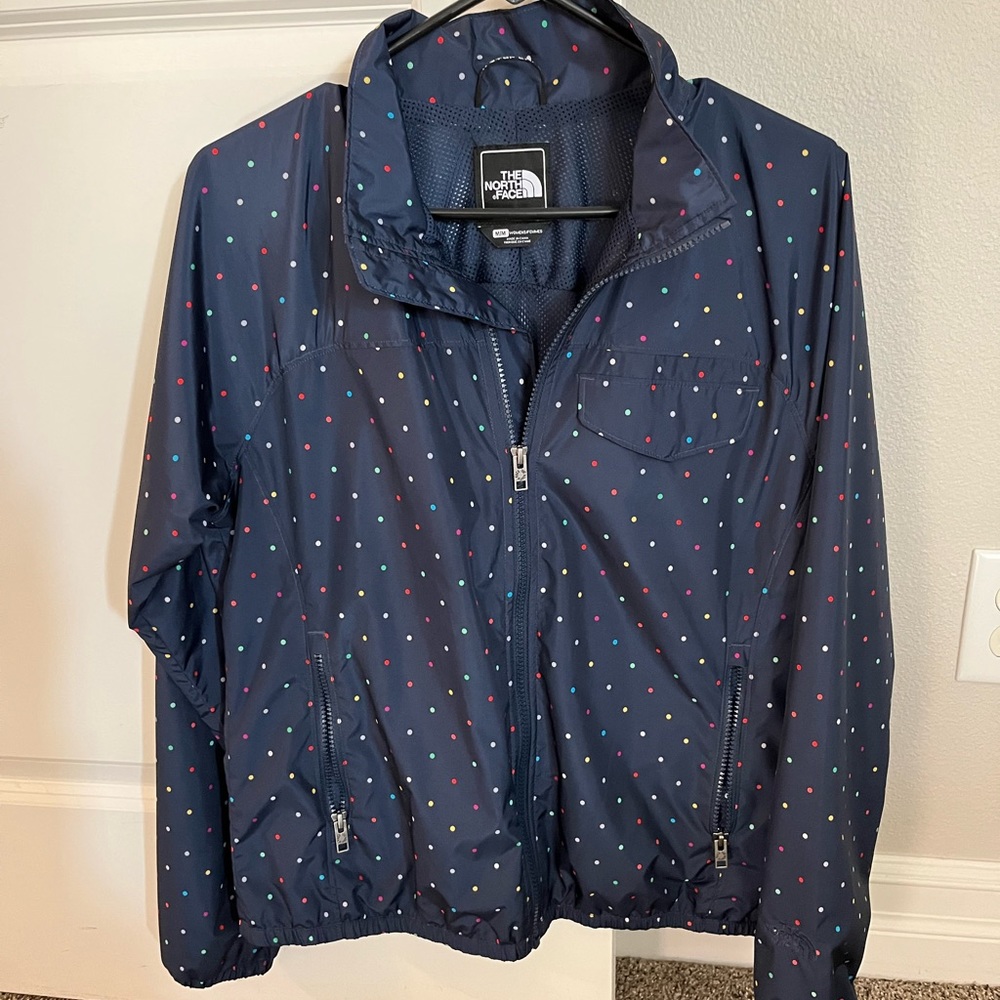 The North Face wind breaker jacket. Navy blue with colorful polka dots.